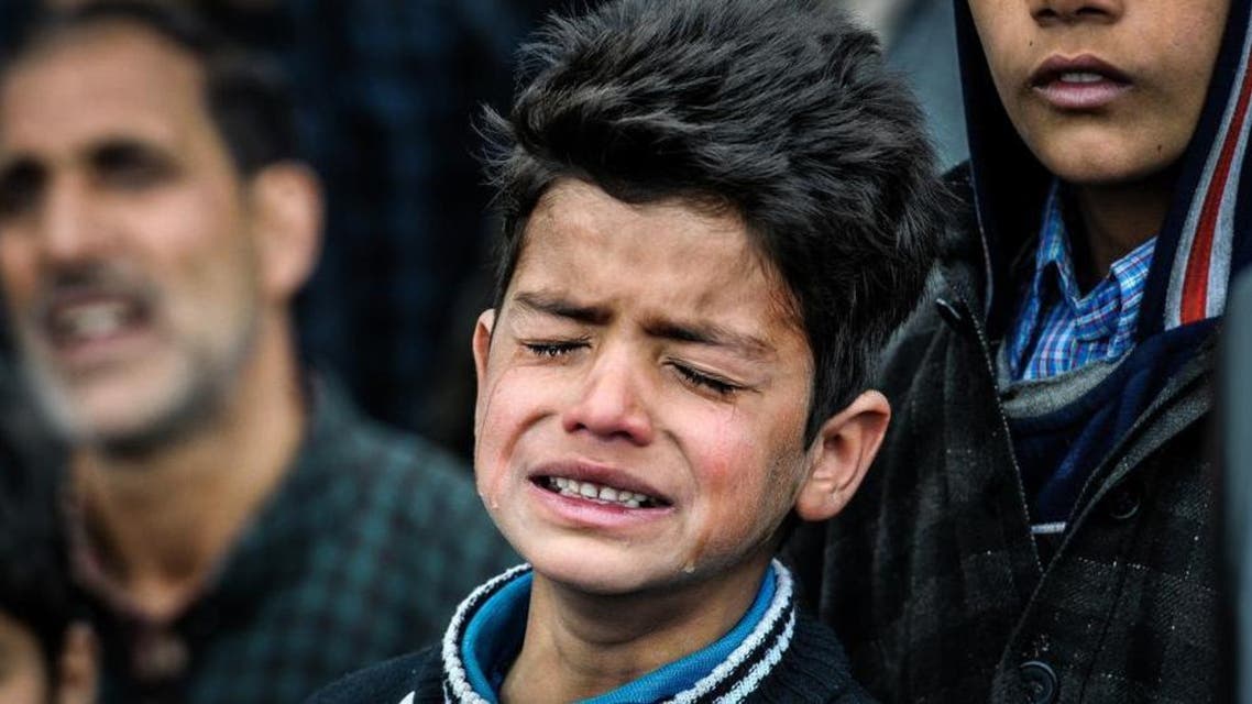 Nine-year-old Burhan Fayaz is seen crying at the funeral of his friend Amir Nazir, a civilian who was killed during an encounter in Pulwama. (Waseem Andrabi / HT Photo)