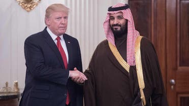 US President Donald Trump and Saudi Deputy Crown Prince and Defense Minister Mohammed bin Salman shake hands in the State Dining Room. (AFP)