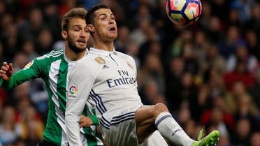 Real Madrid's Cristiano Ronaldo (R) and Real Betis’ German Pezzella in action. reuters