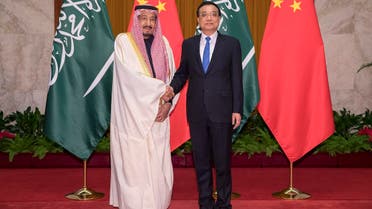 Chinese Premier Li Keqiang (R) shakes hands with Saudi King Salman (L) at Great Hall of the People in Beijing on March 17, 2017. (AFP)