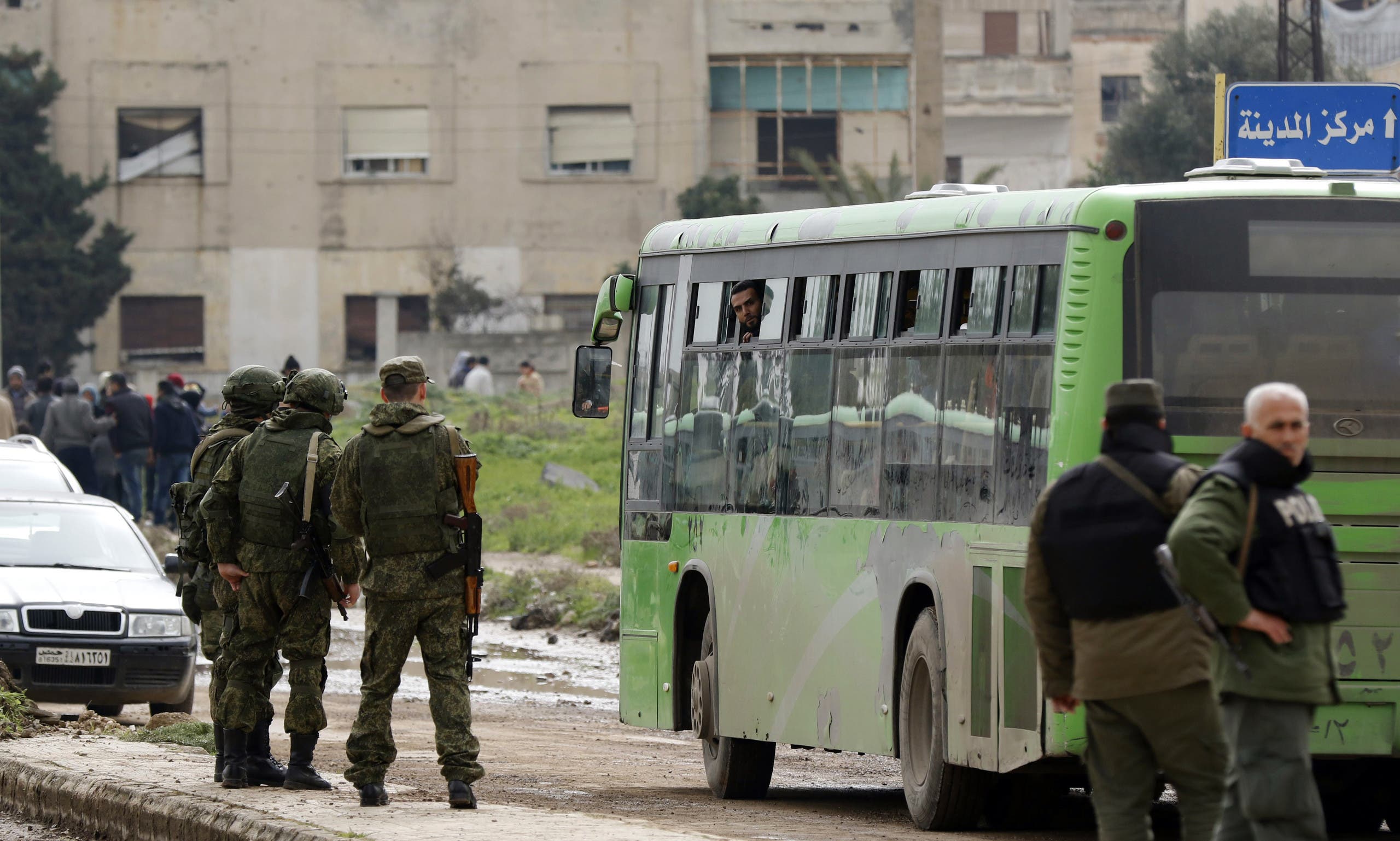 syrian rebels families begin leaving homs district