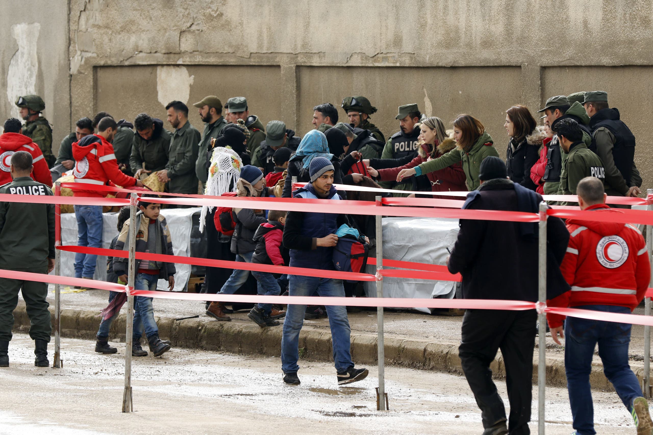 syrian rebels families begin leaving homs district