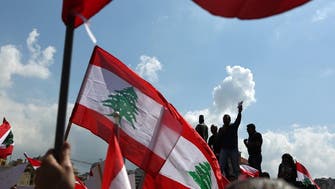 Hundreds of Lebanese protest proposed tax hikes as PM pelted with water bottles