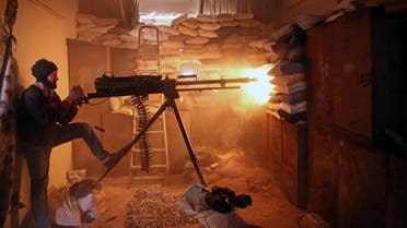 An opposition fighter from the Failaq al-Rahman brigade fires a heavy machine gun in Jobar, a rebel-held district on the eastern outskirts of the Syrian capital Damascus, on March 19, 2017. (AFP)