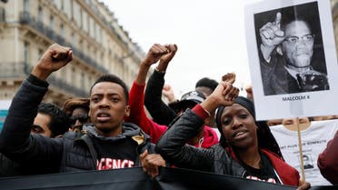 People take part in a demonstration called by the families of the victims of alleged police brutality. (AFP)