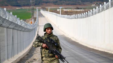 A Turkish soldier patrols along a wall on the border line between Turkey and Syria near the southeastern city of Kilis, Turkey, March 2, 2017