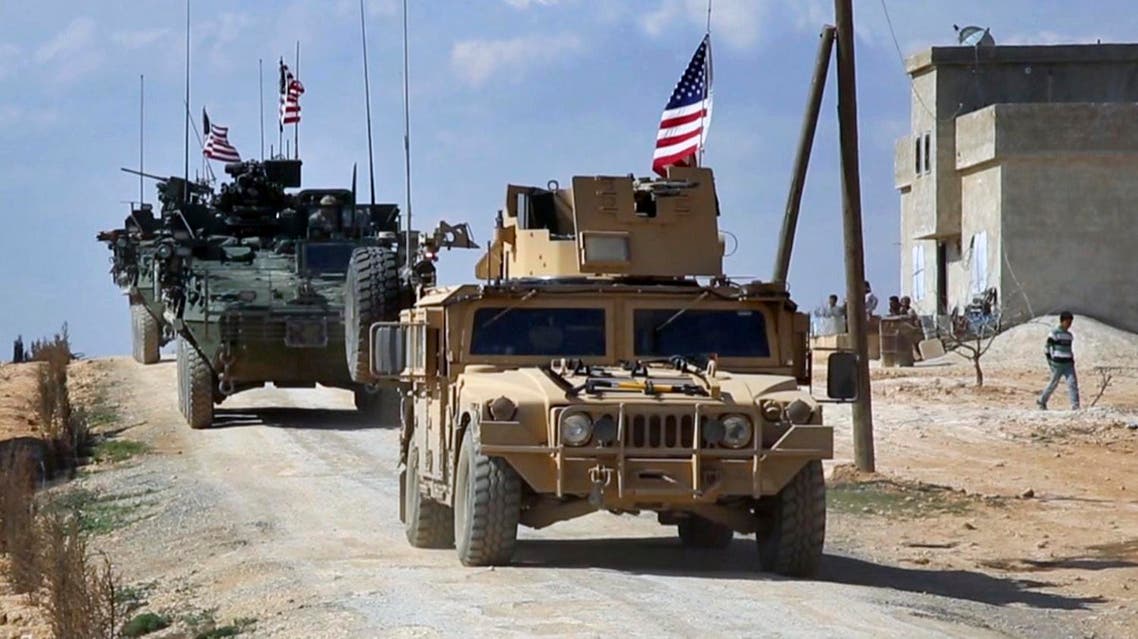 This Tuesday, March 7, 2017 frame grab from video provided by Arab 24 network, shows U.S. forces patrol on the outskirts of the Syrian town, Manbij, a flashpoint between Turkish troops and allied Syrian fighters and U.S.-backed Kurdish fighters, in al-Asaliyah village, Aleppo province, Syria. (AP)