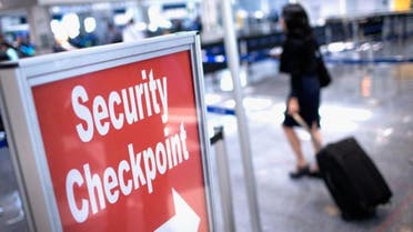 A sign directs travelers to a security checkpoint staffed by Transportation Security Administration (TSA) workers at O'Hare Airport on June 2, 2015 in Chicago