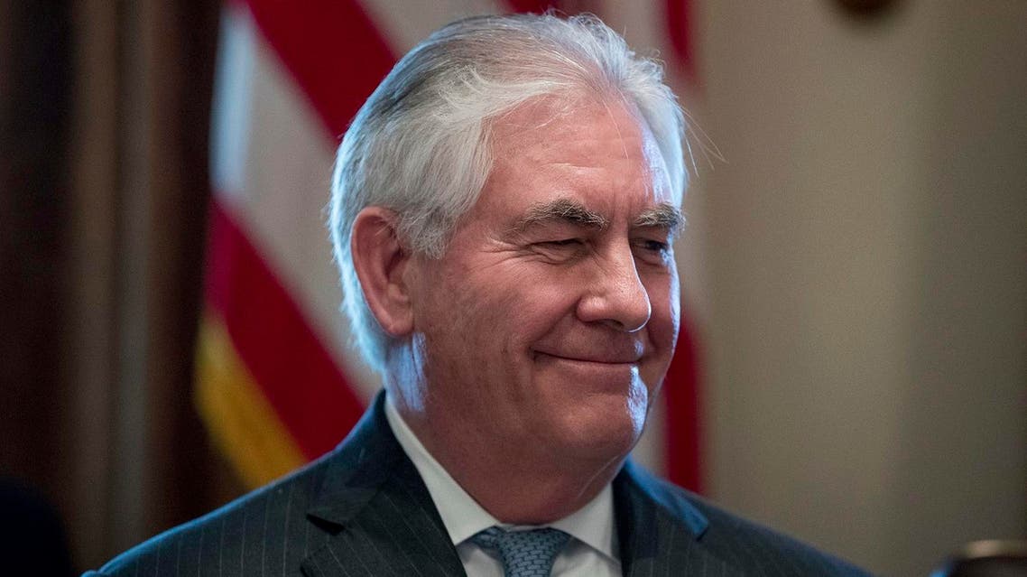 Secretary of State Rex Tillerson smiles as President Donald Trump speaks during a Cabinet meeting in the Cabinet Room of the White House in Washington, Monday, March 13, 2017. (AP