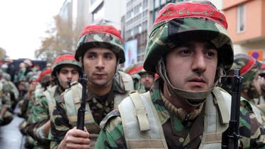 Members of Iran’s paramilitary Basij militia parade in front of the former US embassy in Tehran on November 25, 2011 to mark the national Basij week. (AFP)