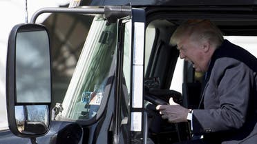US President Donald Trump sits in the drivers seat of a semi-truck as he welcomes truckers and CEOs to the White House in Washington, DC, March 23, 2017, to discuss healthcare. (AFP)