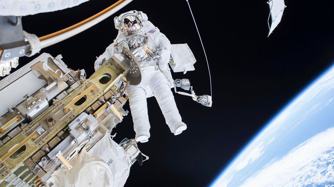 Expedition 46 Flight Engineer Tim Kopra performs a spacewalk outside the International Space Station in this December 21, 2015 NASA handout photo. (Reuters)