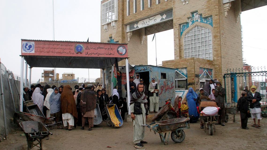 Families wait to cross the Afghanistan-Pakistan border point in Spin Boldak, Kandahar province, Afghanistan, on March 7, 2017. (AP)