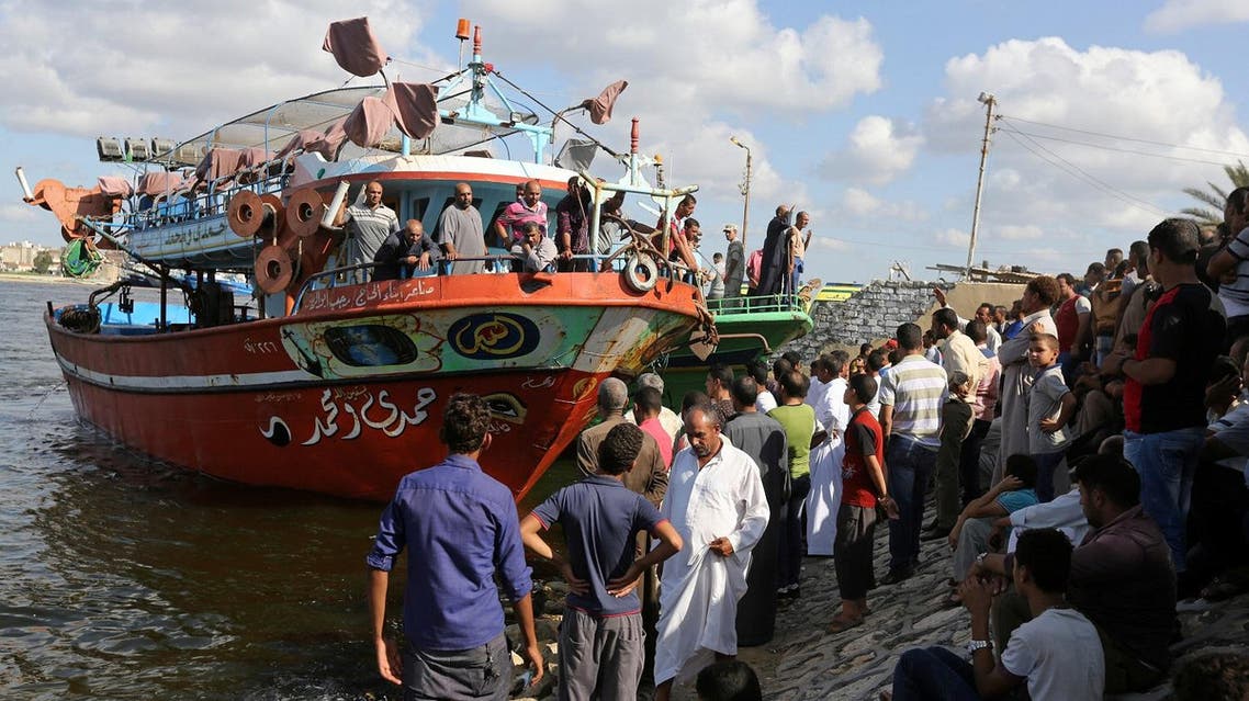 People gather along the shore of the Mediterranean Sea during a search for victims after a migrant boat capsized, in Al-Beheira, Egypt, September 22, 2016. REUTERS/Mohamed Abd El Ghany