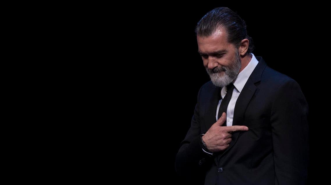 Spanish actor Antonio Banderas gestures after receiving the honorary Gold Biznaga award during the 20th International Malaga Film Festival in Malaga on March 25, 2017. (AFP)