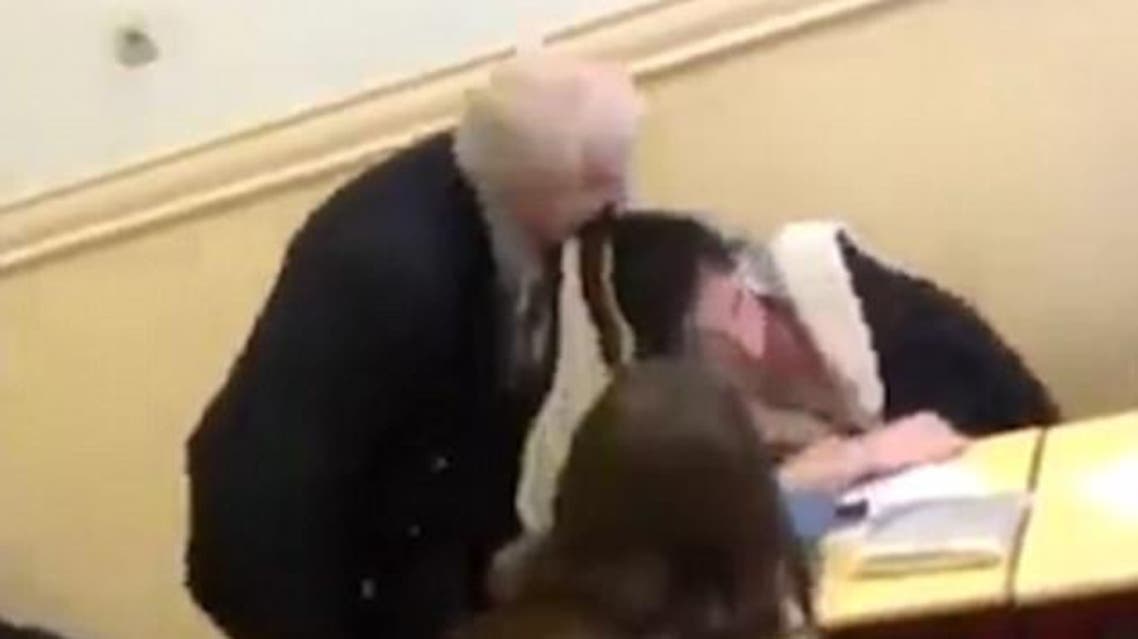 The teacher appears to use the biting tactic to wake up the girl who was seemingly snoozing.