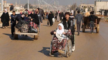 Displaced Iraqis flee their homes as Iraqi forces battle with ISIS, in western Mosul, Iraq March 24, 2017. (Reuters)