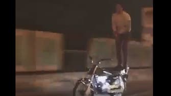 WATCH: Man performs dangerous stunts on moving motorcycle across Cairo bridge