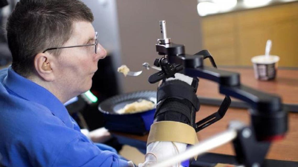 Bill Kochevar, 56, is using computer-brain interface technology and an electrical stimulation system to move his own arm after eight years of paralysis, in this undated handout photo. (Reuters)