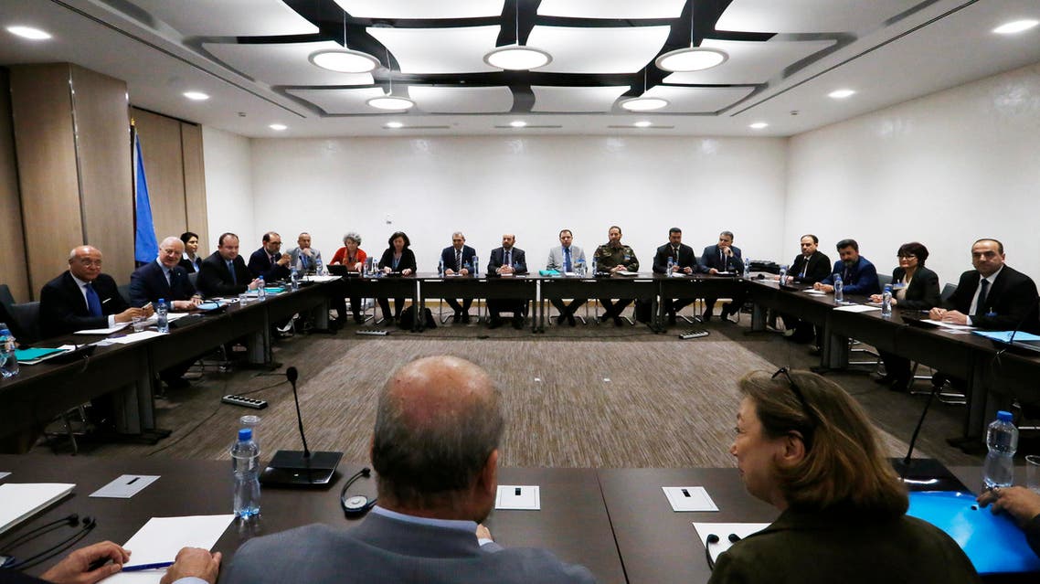 Nasr al-Hariri (R), Head of the Syrian High Negotiations Committee (HNC) opposition group attends a meeting with UN Special Envoy of the Secretary-General for Syria Staffan de Mistura (2ndL) prior to a round of negotiation, during the Intra Syria talks, at the European headquarters of the United Nations in Geneva, on March 24, 2017.