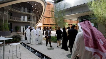 In this Jan. 16, 2011 file photo, people visit the Masdar Institute campus, part of Masdar City, a Mubadala company, in Abu Dhabi. (AP)