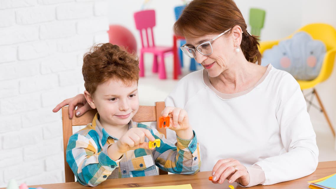 Occupational therapist and little boy