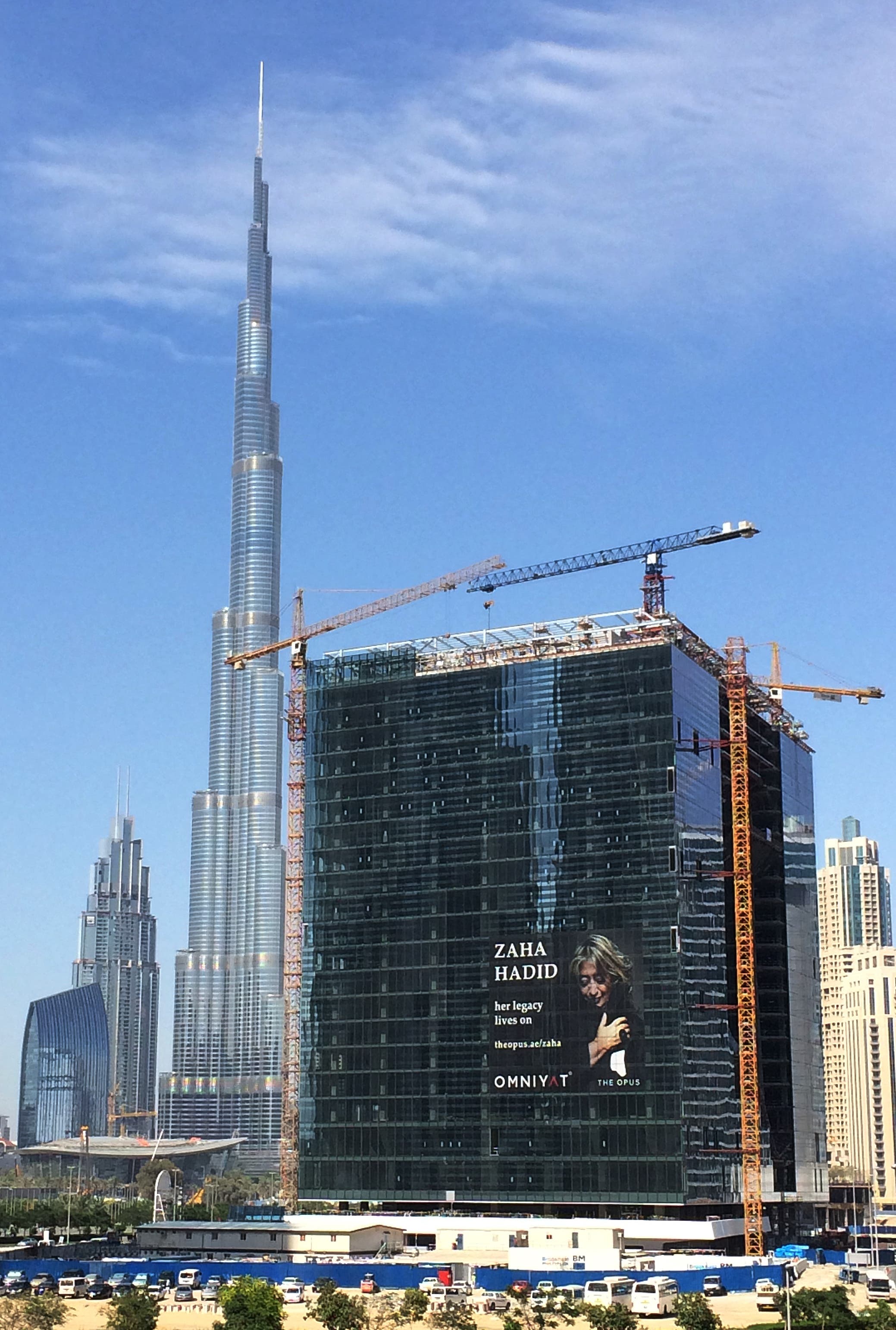 A poster of late Zaha Hadid, Iraqi-born British architect, has been fixed on the elevation of under construction Opus mixed-use building, designed by her in Dubai, UAE, Saturday, April 23, 2016. Pritzker Architecture Prize winner for 2004 Hadid, died from a heart attack aged 65 on March 31, 2016. (AP)