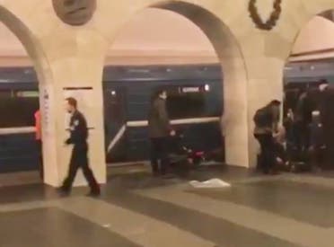 In this image taken from video footage filmed from a moving train on the opposite platform to where the blast occurred, people injured in blast. right, at St. Petersburg's Technological Institute metro station lay on ground, Russia, Monday, April 3, 2017 (Photo: @DARIIIIIINA via AP)