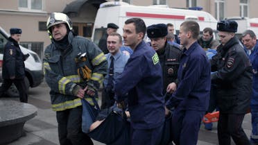 Police and emergency services personnel carry an injured person on a stretcher outside Technological Institute metro station in Saint Petersburg on April 3, 2017 (Photo: Alexander Bulekov/AFP)