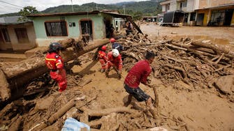 Families in flood-hit Colombian city search for children as death toll rises