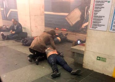In this image taken from video footage filmed from a moving train on the opposite platform to where the blast occurred, people injured in blast at St. Petersburg's Technological Institute metro station lay on ground, Russia, Monday, April 3, 2017 (Photo: @DARIIIIIINA via AP)