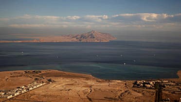 A picture taken on January 14, 2014 through the window of an airplane shows the Red Sea's Tiran (foreground) and the Sanafir (background) islands. (AFP)