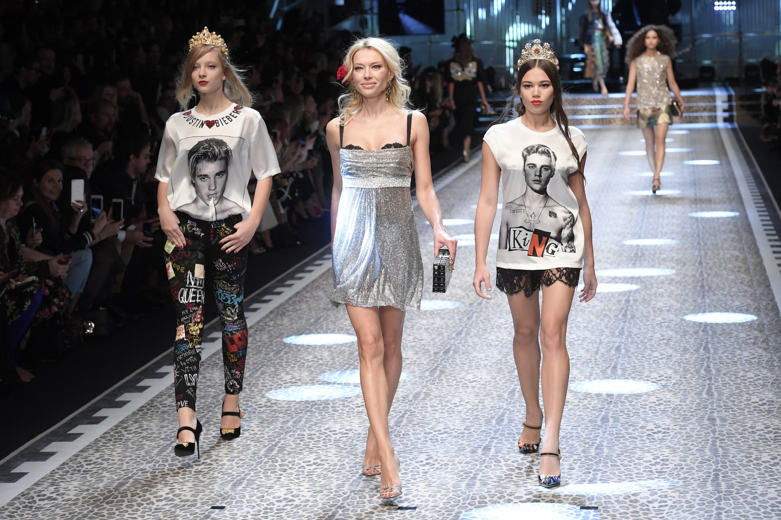 Models present creations for fashion house Dolce & Gabbana during the Women's Fall/Winter 2017/2018 fashion week in Milan, on February 26, 2017. (AFP)