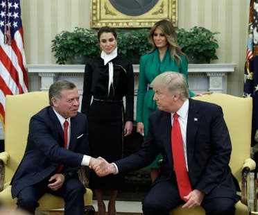 President Donald Trump, accompanied by first lady Melania Trump and Queen Rania, shakes hands with Jordan's King Abdullah II in the Oval Office of the White House in Washington, Wednesday, April, 5, 2017. (AP)