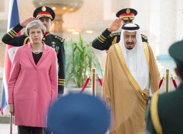 Saudi Arabia's King Salman bin Abdulaziz Al Saud stands next to British Prime Minister Theresa May during a reception ceremony in Riyadh, Saudi Arabia, April 5, 2017. Bandar Algaloud/Courtesy of Saudi Royal Court/Handout via REUTERS ATTENTION EDITORS - THIS PICTURE WAS PROVIDED BY A THIRD PARTY. FOR EDITORIAL USE ONLY.