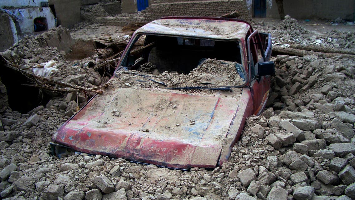 A destroyed car is seen in the rubble after an earthquake in the town of Mashkeel, southwestern Pakistani province of Baluchistan, near the Iranian border April 17, 2013. (Reuters)