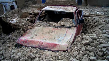 A destroyed car is seen in the rubble after an earthquake in the town of Mashkeel, southwestern Pakistani province of Baluchistan, near the Iranian border April 17, 2013. (Reuters)