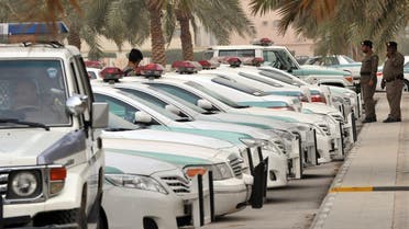 Saudi police cars are parked and policemen stand guard in front of Al-rajhi mosque in central Riyadh on March 11, 2011 as Saudi Arabia launched a massive security operation in a menacing show of force to deter protesters from a planned Day of Rage to press for democratic reform in the kingdom. AFP PHOTO/FAYEZ NURELDINE FAYEZ NURELDINE / AFP