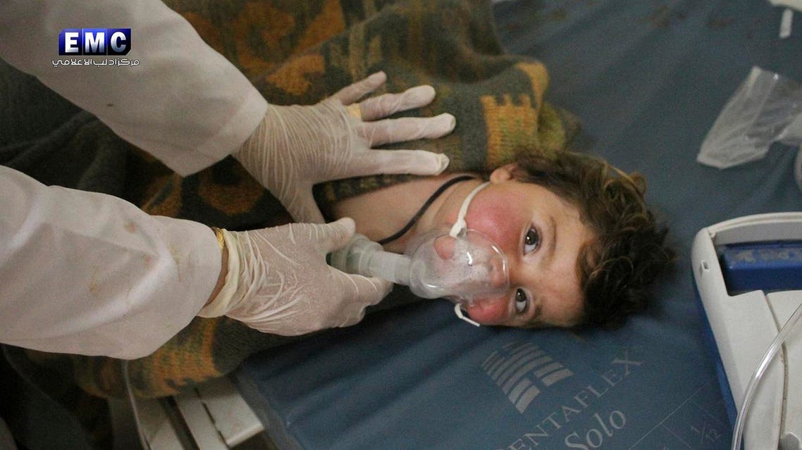 This photo provided Tuesday, April 4, 2017 by the Syrian anti-government activist group Edlib Media Center, which has been authenticated based on its contents and other AP reporting, shows a Syrian doctor treating a child following a suspected chemical attack, at a makeshift hospital, in the town of Khan Sheikhoun, northern Idlib province, Syria. The suspected chemical attack killed dozens of people on Tuesday, Syrian opposition activists said, describing the attack as among the worst in the country's six-year civil war. (Edlib Media Center, via AP)