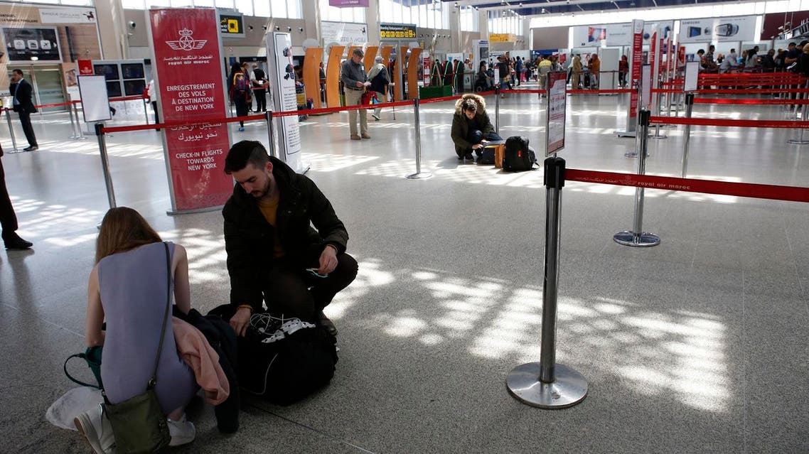Passengers store their electronic items in their suitcases and bags when arriving at the Casablanca-New York flight zone at Casablanca Mohammed V International Airport on Thursday, March 29, 2017. (AP)