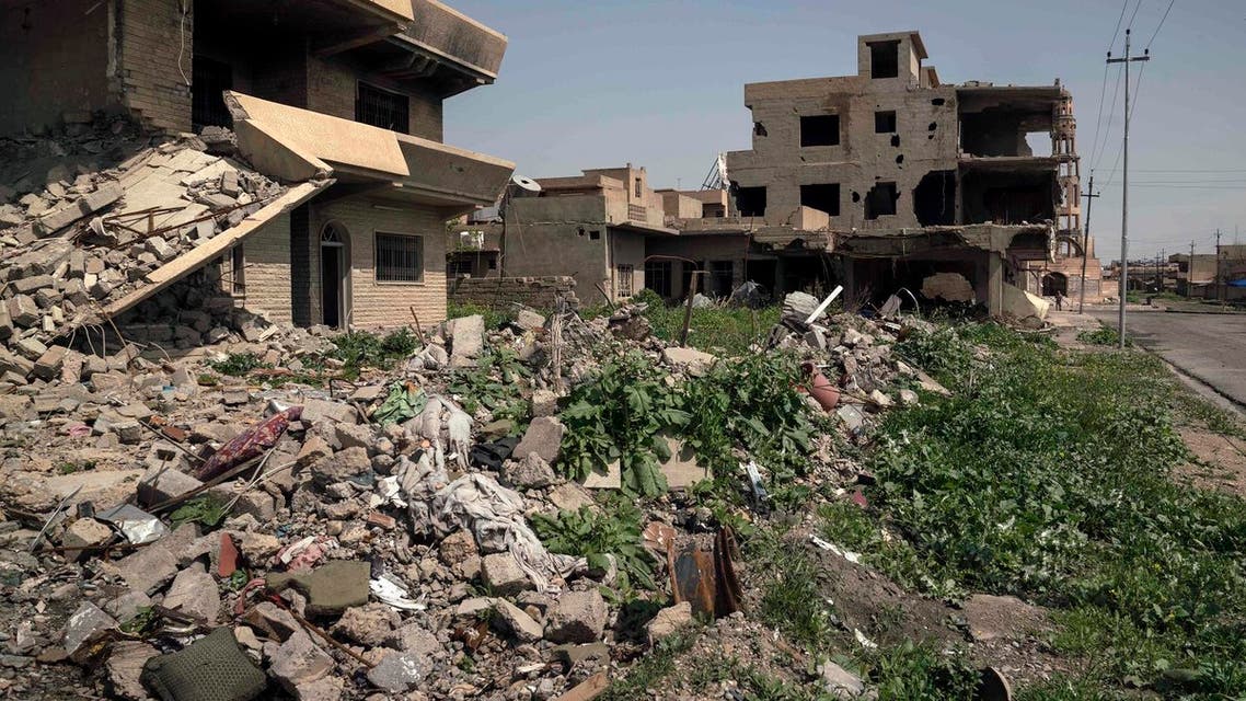 In this March 29, 2017 photo, houses in a residential street are reduced to rubble, on the edge of Hamdaniya, Iraq. (AP)