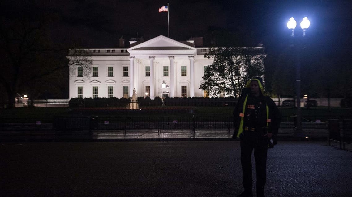 A US Secret Service agent stands in front of the White House in Washington, DC, on April 6, 2017 after the US fired Tomahawk missiles on Syria following an alledged gas attack by Syrian forces three days ago. (AFP)