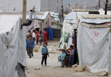 Syrian refugee children are seen outside their makeshift house at an unofficial refugee camp in the village of Deir Zannoun in Lebanon's Bekaa valley. (File photo: Reuters)