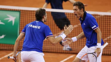 France's Nicolas Mahut and Julien Benneteau react during the Davis Cup world group quarter-final tennis match between France and Britain. (AFP)