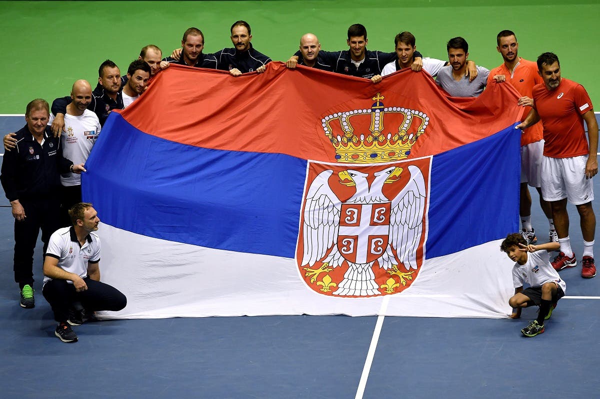Serbia's tennis team celebrate their victory after the Davis Cup World Group quarter-final between Serbia and Spain. (AFP)