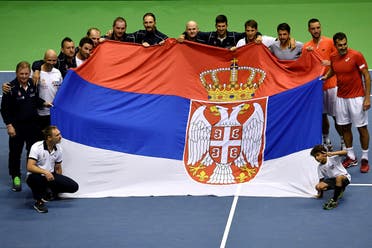 Serbia's tennis team celebrate their victory after the Davis Cup World Group quarter-final between Serbia and Spain. (AFP)