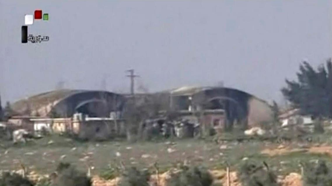 This frame grab from video provided by the Syrian official TV shows the burned and damaged hangar warplanes which were attacked by US Tomahawk missiles, at the Shayrat Syrian government forces airbase (Syrian government TV, via AP)