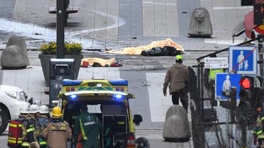 Several dead bodies are seen after a truck crashed into a department store Ahlens, in central Stockholm. (Reuters)