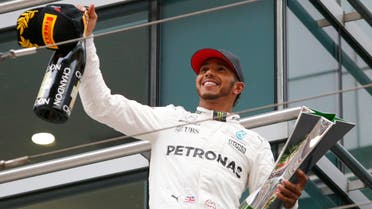 Mercedes driver Lewis Hamilton of Britain acknowledges cheering of spectators before leaving the podium after winning the Chinese Formula One Grand Prix at the Shanghai International Circuit in Shanghai, China, Sunday, April 9, 2017. (AP)