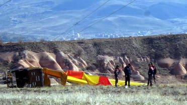 Security members investigate at the site after a hot air balloon hit a high-voltage transmission line and crashed near Cappadocia, a popular tourist destination in central Turkey, Sunday, April 9, 2017. (AP)